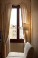 a bedroom with a window with a bed and a lamp at Hotel Ca&#39; D&#39;Oro in Venice