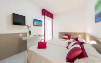 A bed or beds in a room at Zenit Hotel