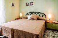Łóżko lub łóżka w pokoju w obiekcie siciliacasevacanze - Casa Maiolica