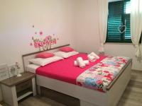 Posteľ alebo postele v izbe v ubytovaní Apartments Biba
