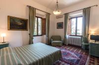 Łóżko lub łóżka w pokoju w obiekcie Hotel Villa Porta All'Arco