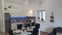 Kuchyň nebo kuchyňský kout v ubytování Apartments Toni