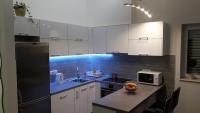 Kuchyň nebo kuchyňský kout v ubytování Apartments Toni
