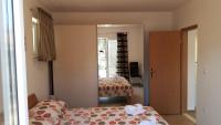 Postel nebo postele na pokoji v ubytování Apartments Toni