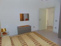 A bed or beds in a room at Appartamenti Budoni
