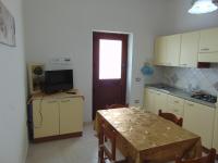 A kitchen or kitchenette at Appartamenti Budoni