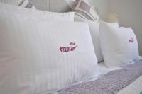 Łóżko lub łóżka w pokoju w obiekcie Hotel Ottaviano