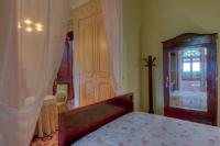 A bed or beds in a room at Hotel Casa Ceremines