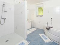 a bathroom with a shower and a tub and a sink at Amazing Holiday Home in Cazals with Terrace in Cazals