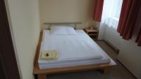 Postel nebo postele na pokoji v ubytování Hotel THT