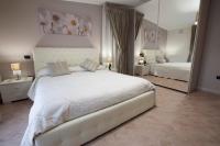 A bed or beds in a room at Amira Luxury Apartments