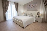 A bed or beds in a room at Amira Luxury Apartments
