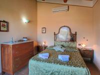 A bed or beds in a room at Tranquil Cottage Retreat in Todi, Umbria