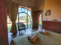 A bed or beds in a room at Tranquil Cottage Retreat in Todi, Umbria