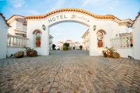 a hotel entrance with a hotel sign on it at Hotel Diufain in Conil de la Frontera