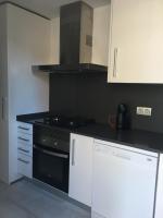 Kuchyň nebo kuchyňský kout v ubytování Apartaments El Cine