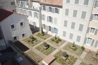 an overhead view of a courtyard in front of a building at Les Appartements du Vieux Port in Marseille