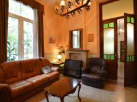 a living room with two leather couches and a tv at This plain house is very suitable for groups in Ferrières