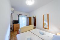 Postel nebo postele na pokoji v ubytování Apartments Garden Beach