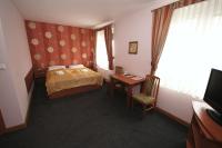 Łóżko lub łóżka w pokoju w obiekcie Hotel Vega