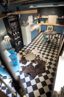 an aerial view of a kitchen with blue cabinets and a table at Le B. VINTAGE in Riquewihr