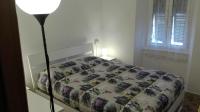 A bed or beds in a room at Appartamenti La Quiete
