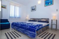 Posteľ alebo postele v izbe v ubytovaní Vidučić Apartments