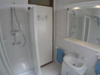 a bathroom with a shower and a toilet and a sink at Condominio Sole - Agenzia Cocal in Caorle