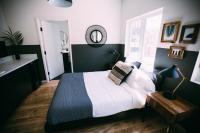 a bedroom with a large bed and a window at Noon on Sunset Hill in Los Angeles