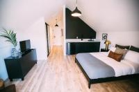 a bedroom with a large bed and a sink at Noon on Sunset Hill in Los Angeles