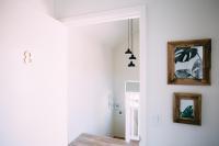 a white room with two pictures on the wall at Noon on Sunset Hill in Los Angeles