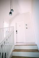 a staircase with a white door in a house at Noon on Sunset Hill in Los Angeles