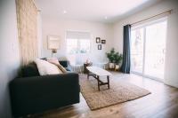 a living room with a couch and a table at Noon on Sunset Hill in Los Angeles