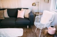 a living room with a couch and a chair at Noon on Sunset Hill in Los Angeles
