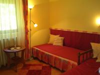 Łóżko lub łóżka w pokoju w obiekcie Balázs Apartman