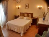 Postel nebo postele na pokoji v ubytování Hotel Rural Ovio