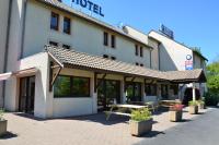 a building with a picnic table in front of it at The Originals City, Hôtel Amys, Tarbes Sud (Inter-Hotel) in Odos