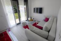 TV a/nebo společenská místnost v ubytování Apartments Taratta 1