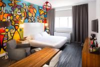 a hotel room with a bed and a table at NU Hotel in Brooklyn