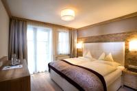 A bed or beds in a room at Hotel Bismarck