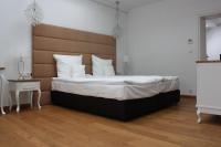 Posteľ alebo postele v izbe v ubytovaní Hotel Alhambra
