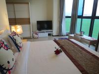 a bedroom with a large bed and a television at Grand Allevia Villa in Wujie