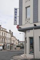 a building with a sign on the side of a street at Cit&#39;Hotel Europeen in Angoulême