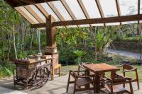 a outdoor kitchen with a wooden stove and a table at Mudanwan Villa in Mudan