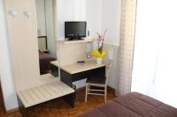 Telewizja i/lub zestaw kina domowego w obiekcie Hotel Allo Zodiaco
