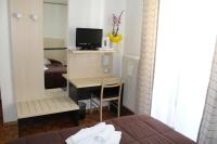 Telewizja i/lub zestaw kina domowego w obiekcie Hotel Allo Zodiaco