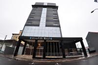 a tall building with a main sqor hotel at Klein Ville São Leopoldo in São Leopoldo