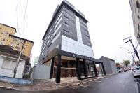 a tall building on a city street at Klein Ville São Leopoldo in São Leopoldo