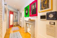 A television and/or entertainment centre at Vatican Rooms Irene