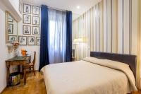 A bed or beds in a room at Vatican Rooms Irene